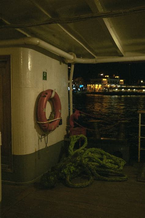 Ferry Boat Deck with Ropes and Lifebouy · Free Stock Photo