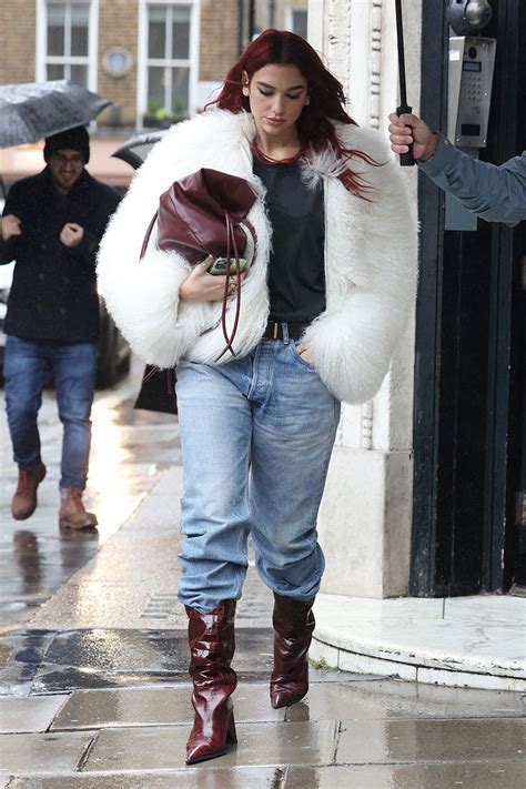 Dua Lipa Braves A Rainy Day In A Cloud Like Coat Get The Look