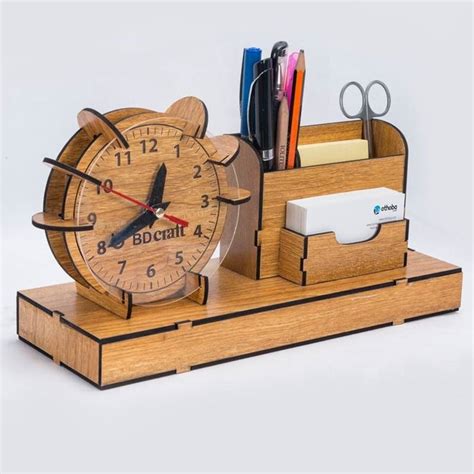 A Wooden Desk Clock With Pen And Pencil Holder On It S Stand Which