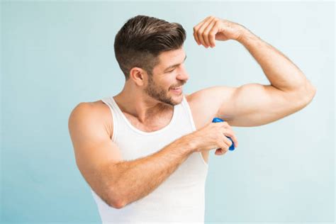 530 Man Putting On Deodorant Stock Photos Pictures And Royalty Free