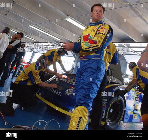 Robby Gordon Watches As His Team Prepares His Car For Practice For The