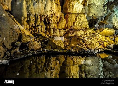 Reflections of stalagmites on pool of water inside Cathedral Caverns State Park, Woodville ...