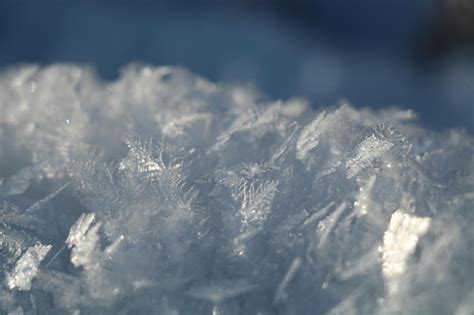 Premium Photo Close Up Of Snowflakes On Snow