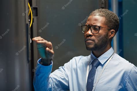 Premium Photo Portrait Of African American Network Engineer Setting