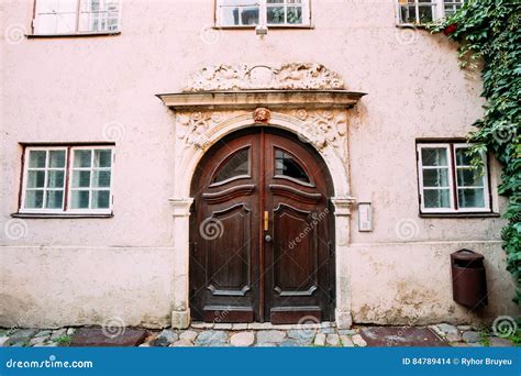 Riga Latvia Wooden Door Of Portal Decorated By Molding On Facade Stock