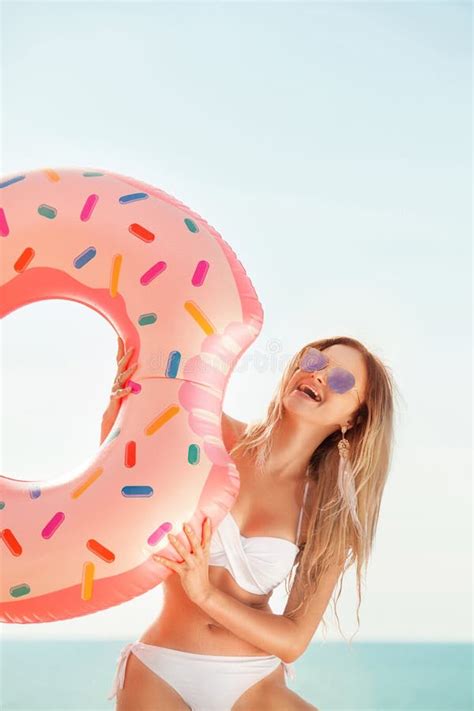 Summer Vacation Enjoying Suntan Woman In White Bikini With Donut