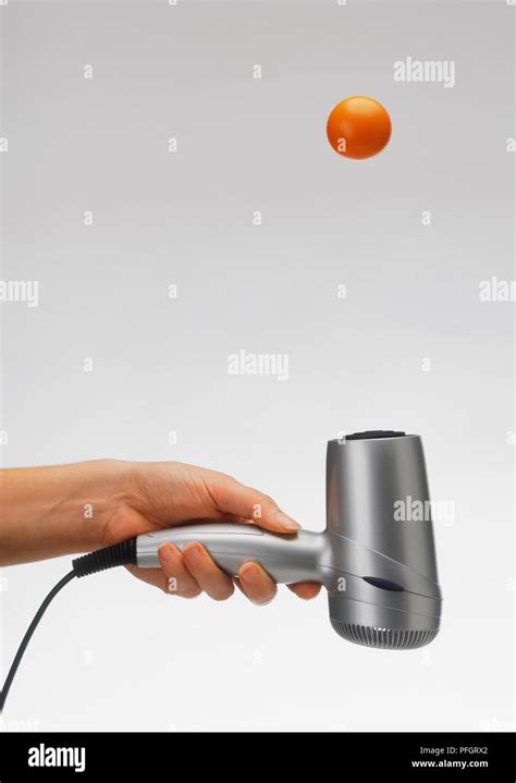 Air Stream Experiment Using Hairdryer Pointed At Hovering Ping Pong