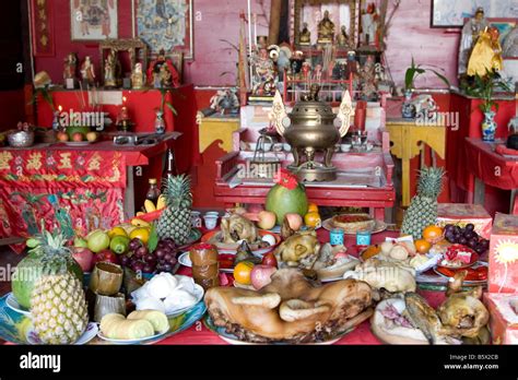 Table Full Of Food Offerings At A Chinese Temple In Thailand Stock