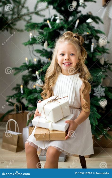 Happy Cute Little Smiling Girl with Christmas Gift Box. Merry Christmas ...