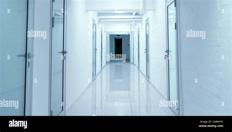 Empty corridor in hospital with closed doors Stock Photo - Alamy