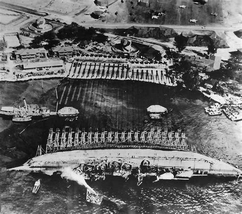 Crew work in Pearl Harbor to right the battleship USS Oklahoma 1943 ...