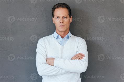 Confident Mature Man Confident Mature Man Keeping Arms Crossed And