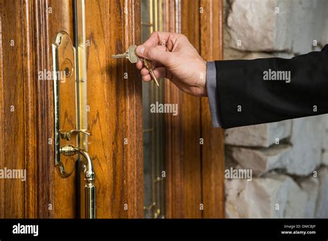 Man Unlocking Front Door Stock Photo Alamy