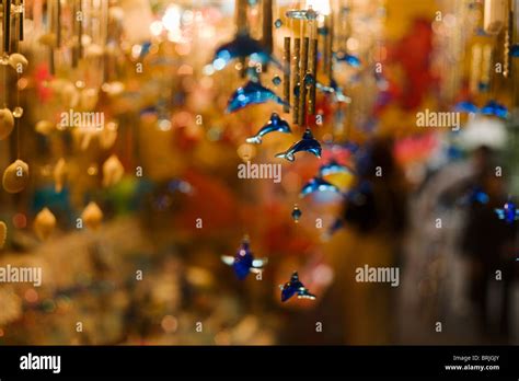 Blue Glass Dolphin Wind Chimes With Minimum Depth Of Field Stock Photo