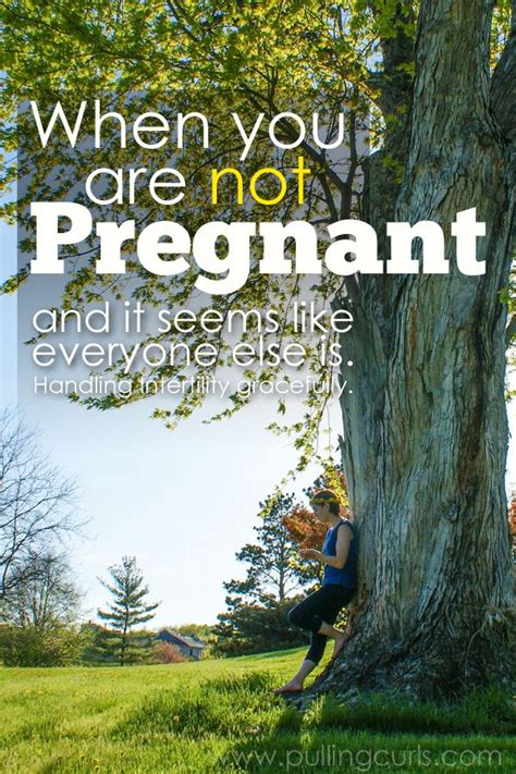 A Woman Sitting Under A Tree With The Words When You Are Not Pregnant