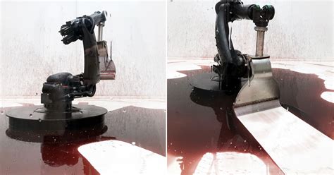 industrial robot continuously sweeps blood-like fluid in sun yuan + peng yu's 'can't help myself'