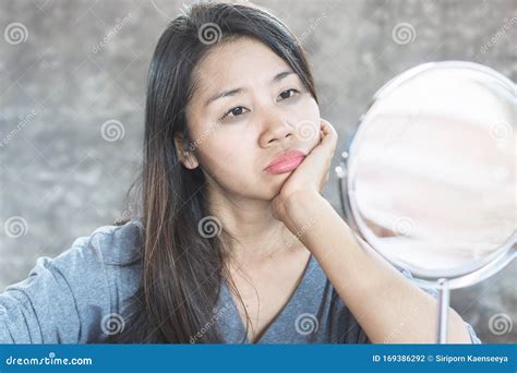 Unhappy Asian Woman Age 40 Checking Her Dark Eyes Circle Problem In