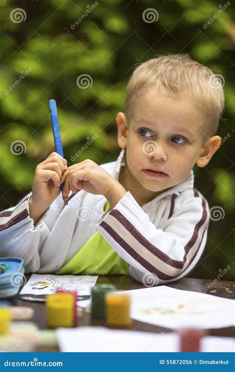 Little Boy Thinking with a Pencil while Drawing. Education. Stock Photo ...