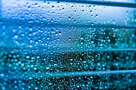 Premium Photo Water Drops On A Glass Surface