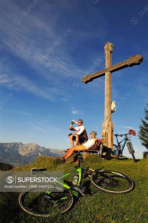 Mountain Bikers Resting At The Kraftalm Alp Wilder Kaiser Massif At