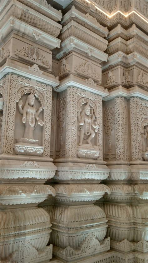 Intricately Carved Wall With Sculptures And Lights