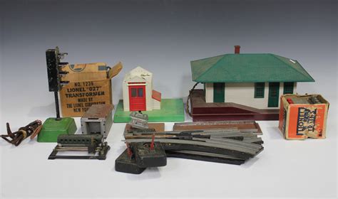 A collection of Lionel gauge O items, including five locomotives, a ...