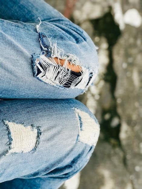 Premium Photo Midsection Of Person Wearing Torn Jeans