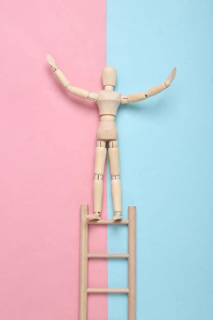 Premium Photo Wooden Puppet Climbs Up The Stairs On A Bluepink Pastel