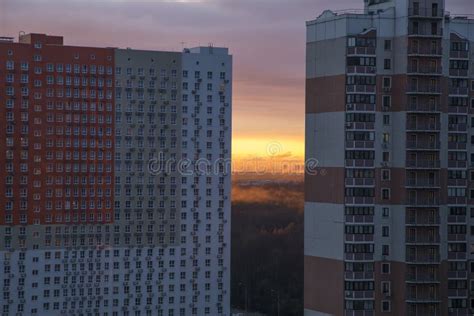 Beautiful And Colorful Sunset Behind The Houses In The City Stock Photo