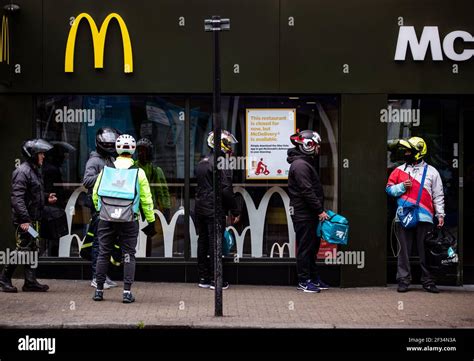 Delivery riders waiting outside McDonald’s in Tooting, South London waiting to food collections ...