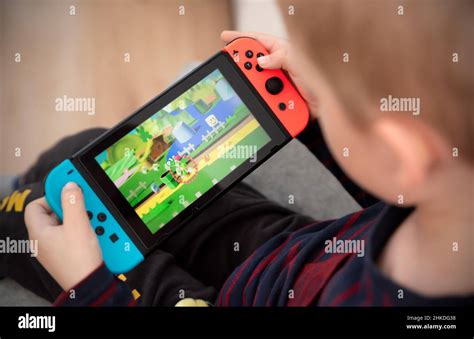 Wroclaw, Poland - JAN 27, 2022: Boy plays Nintendo Switch console ...