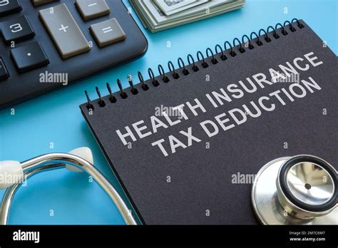 Health Insurance Tax Deduction Inscription Stethoscope And Calculator