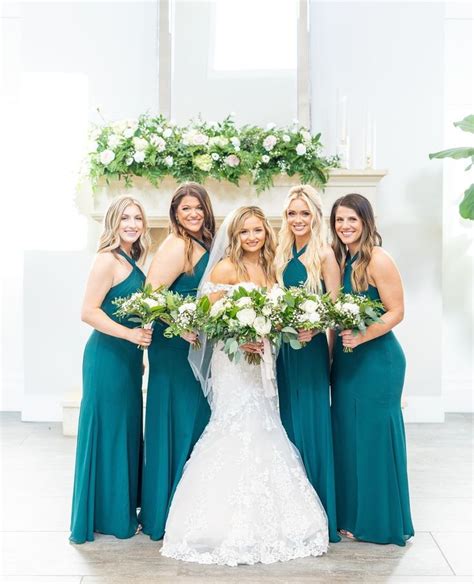 The Bride And Her Bridesmaids Pose For A Photo