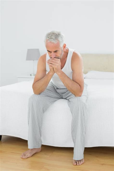 Thoughtful Mature Man Yawning In Bed Stock Image Image Of Vest House