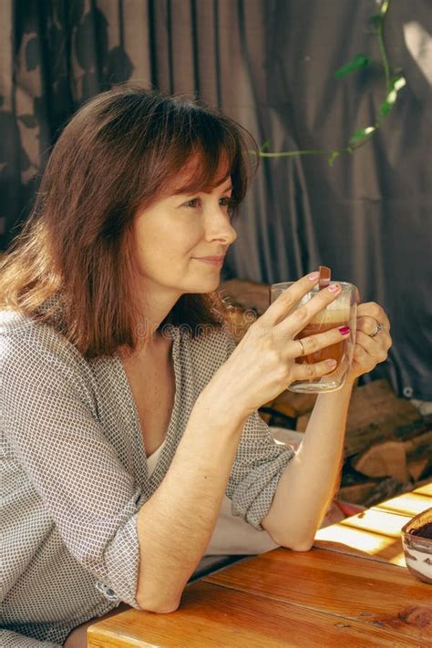 Pretty Woman Drinking Coffee In Sidewalk Cafe Brunette With Morning