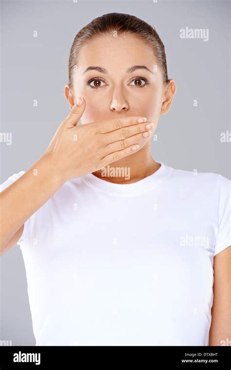 Shocked Woman With Her Hand To Her Mouth Stock Photo Alamy