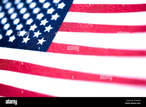 A Macro Shot With Selective Focus Of A Small Handheld American Flag On