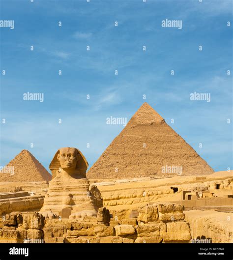 Front facing Sphinx and the large Egyptian Pyramids of Khafre, Menkaure slightly offset in front ...