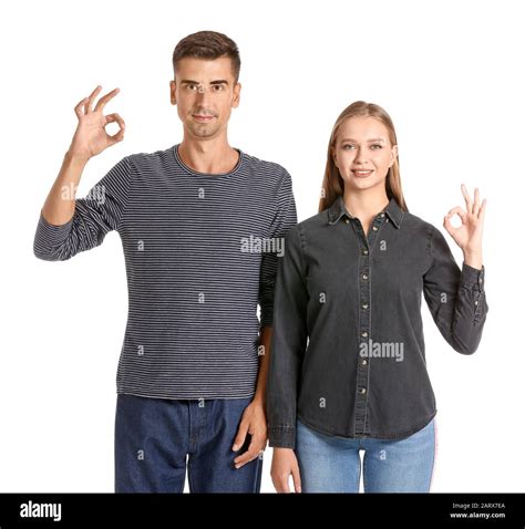 Young Deaf Mute Couple Using Sign Language On White Background Stock