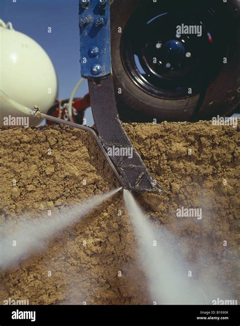 ANHYDROUS AMMONIA APPLICATION KNIFE SHOWING BURST OF AMMONIA Stock Photo - Alamy