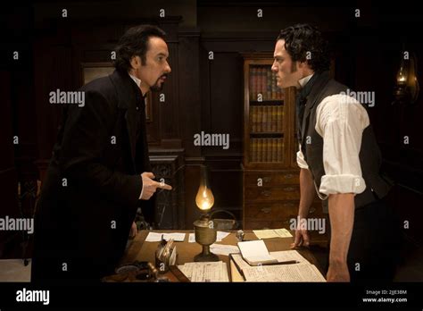 John Cusack Luke Evans The Raven 2012 Stock Photo Alamy