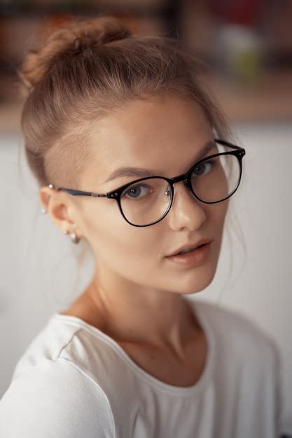 Premium Photo Portrait Of A Cute Blonde Wearing Glasses At Home