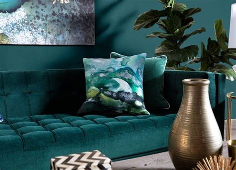 The Jewel Tone Trend How And Where To Use These Hues In 2020 Jewel Living Room Teal Sofa