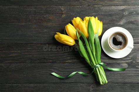 Beautiful Yellow Tulips And Cup Of Coffee On Wooden Background Stock