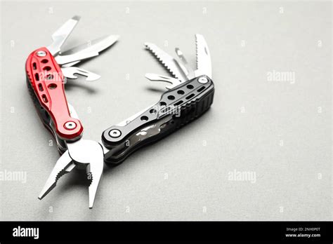 Compact Portable Multitool On Light Grey Background Closeup Space For