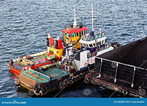 Various Views Of Vessels And Tugboats In Port Close Up View Of The