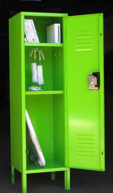 A Green Locker With Two Doors Open And Some Books On Its Shelfs