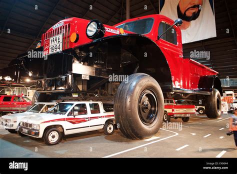 Huge Dodge Truck In Rainbow Sheikh Museum In Uae With Cars Parked Below