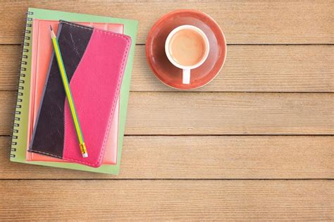 Premium Photo Notebooks And Cup Of Coffee On Office Desk Or Wood Table