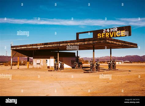 Abandoned Gas Station With Sign Reading 24 Hour Service With Vintage